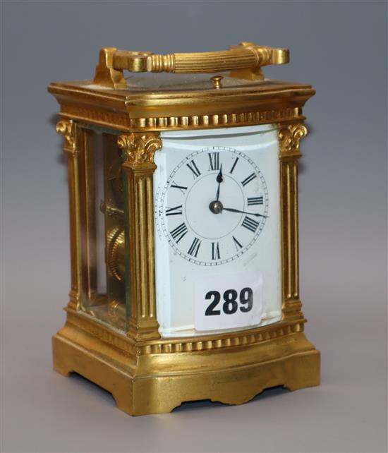 A late 19th century French gilt brass eight day repeating carriage clock, with bow front case height 14cm